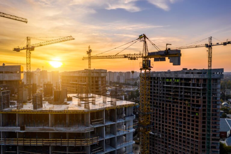 construction site with cranes sunset construction apartment building